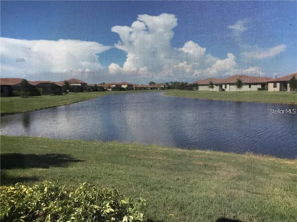 an outdoor sitting area with furniture and a garden