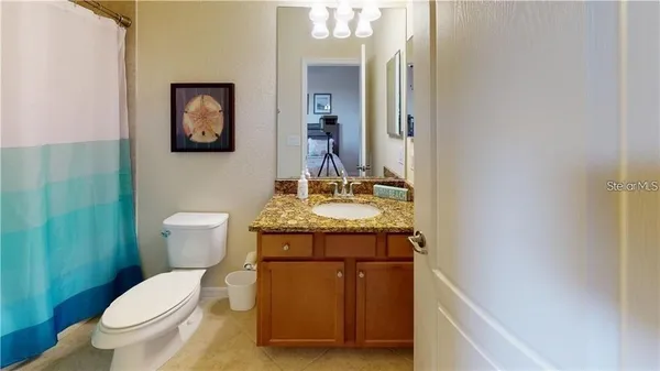 a bedroom with a bed and chair