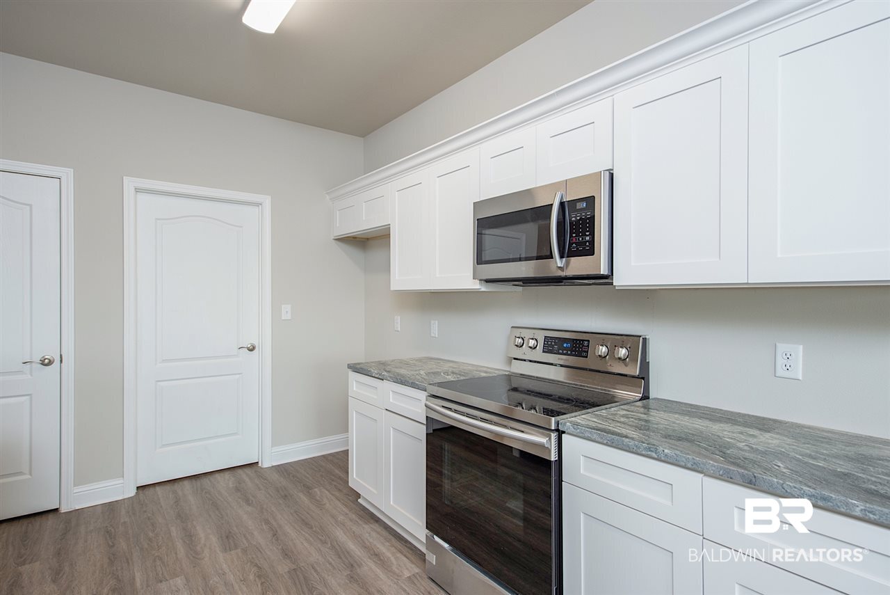 16936 Prado Loop Loxley, AL 36551 - Photo 13 of 33 Door Leading to Pantry & Garage