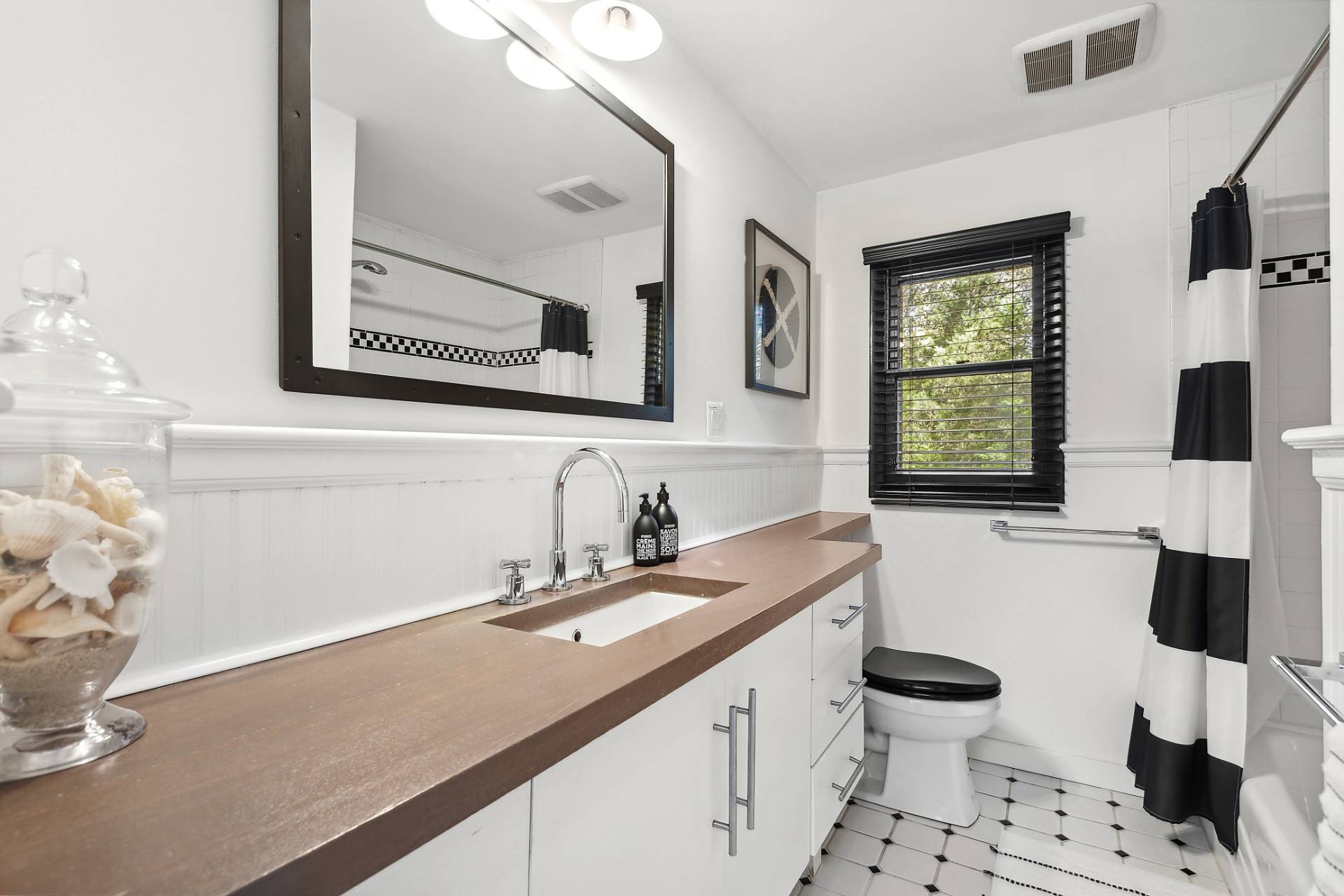 1510 Sagg Road Sag Harbor, NY 11963 - Photo 11 of 22 a bathroom with a sink double vanity and a mirror