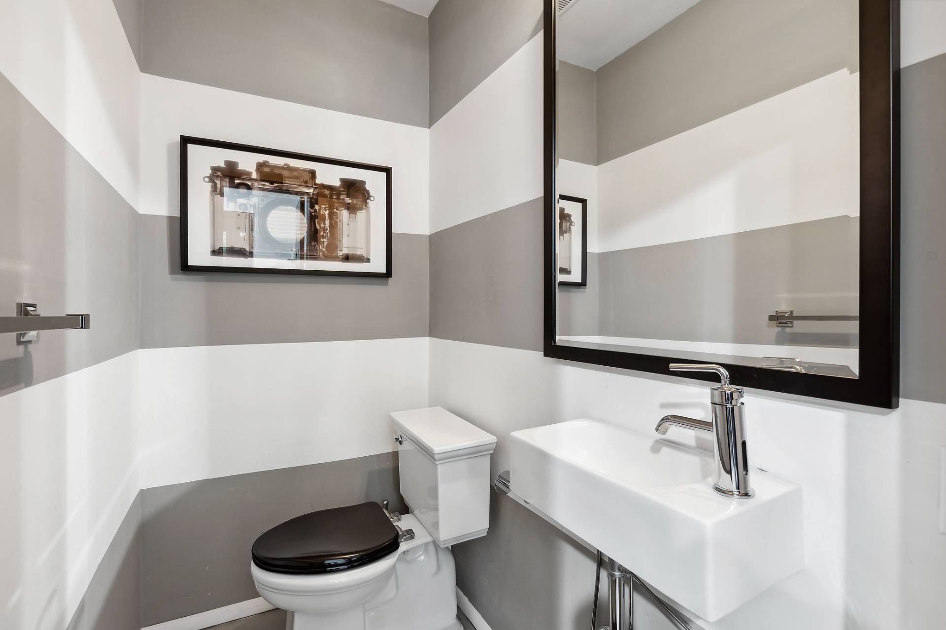 1510 Sagg Road Sag Harbor, NY 11963 - Photo 15 of 22 a bathroom with a sink a toilet and a mirror