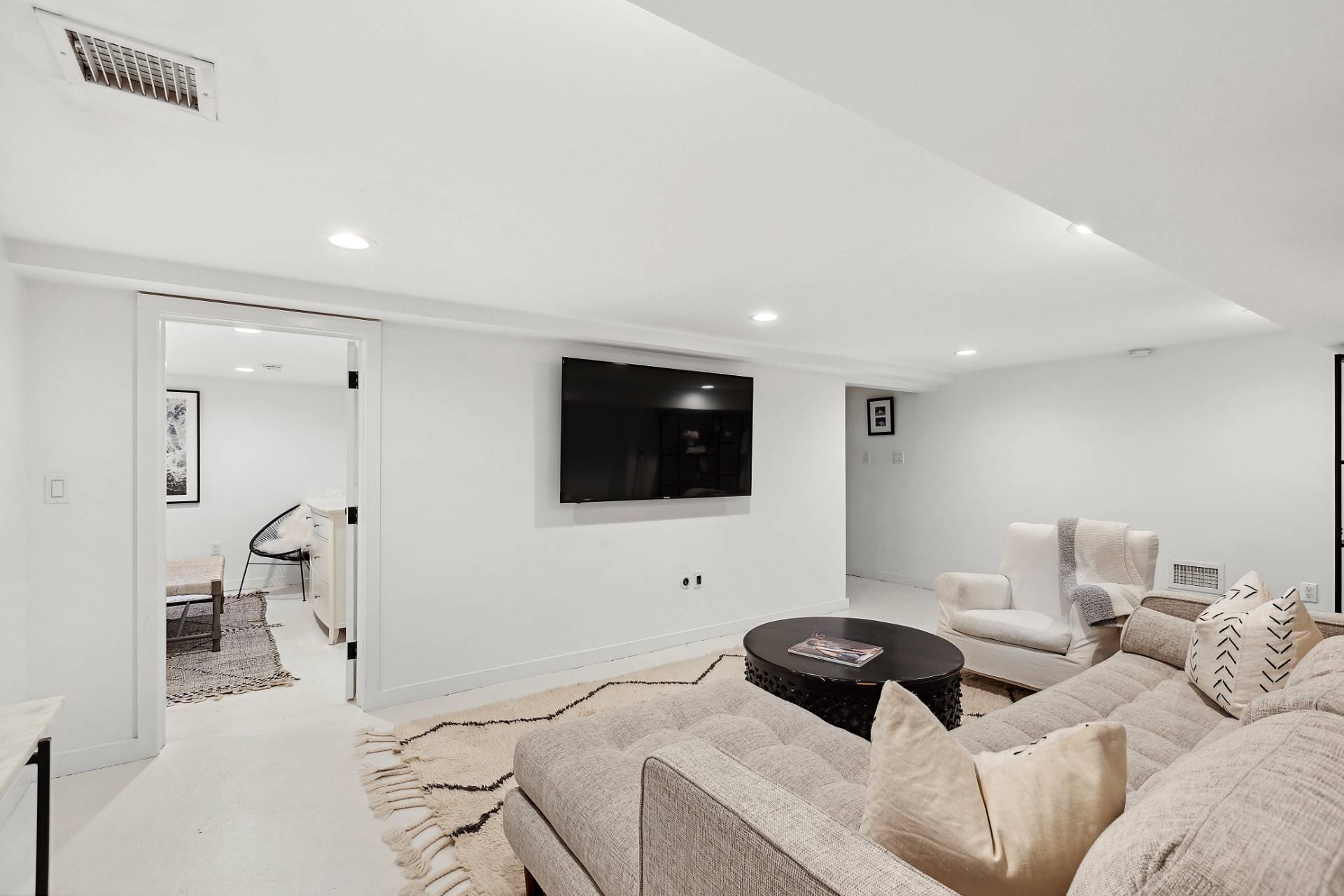 1510 Sagg Road Sag Harbor, NY 11963 - Photo 16 of 22 a bedroom with a bed and a flat screen tv