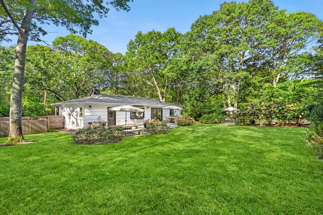 a view of a swimming pool with a yard