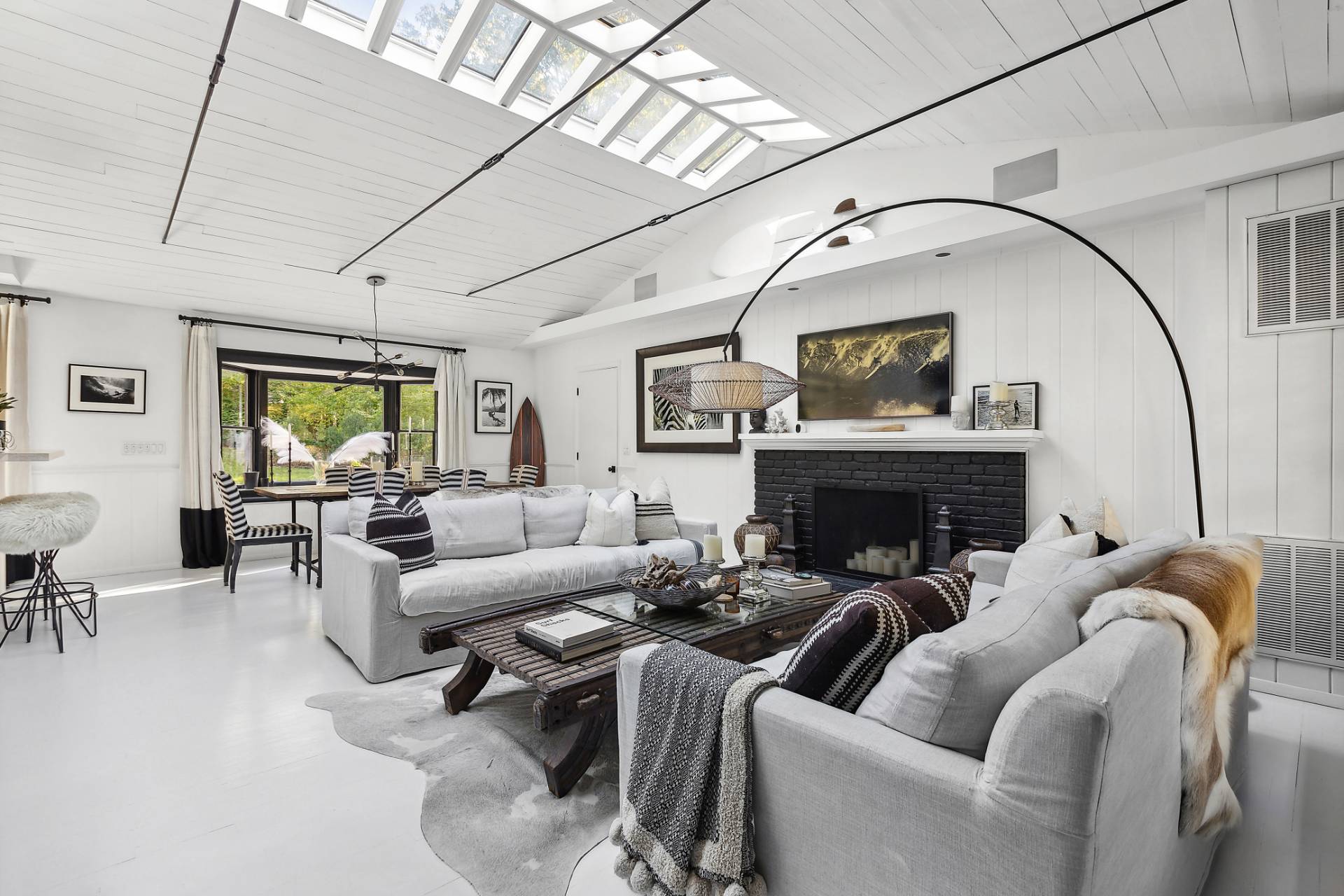1510 Sagg Road Sag Harbor, NY 11963 - Photo 3 of 22 a living room with furniture a fireplace and a large window