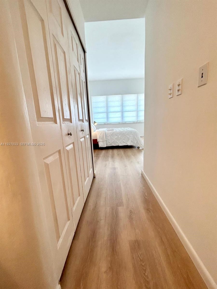 100 Lincoln Road, Unit 1621 Miami Beach, FL 33139 - Photo 9 of 15 a view of a room with wooden floor and stairs