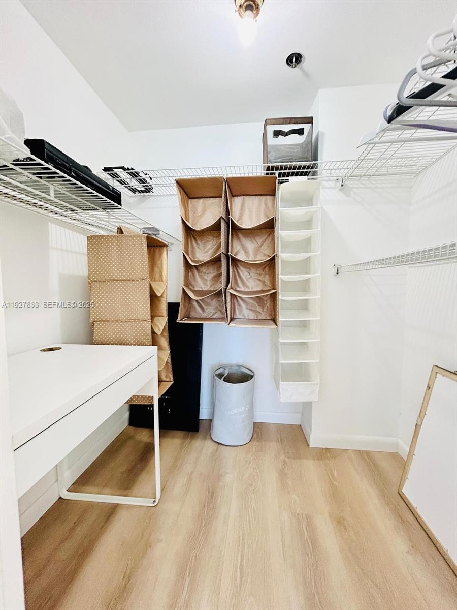100 Lincoln Road, Unit 1621 Miami Beach, FL 33139 - Photo 10 of 15 a bathroom with a sink and mirror