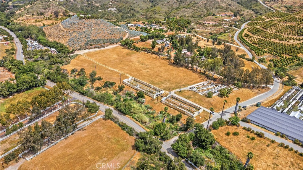 9104 Huntley Road Fallbrook, CA 92028 - Photo 6 of 14 an aerial view of residential houses with outdoor space