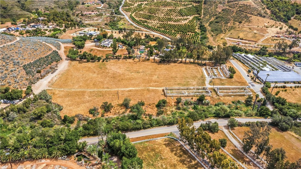 9104 Huntley Road Fallbrook, CA 92028 - Photo 7 of 14 an aerial view of residential houses with outdoor space