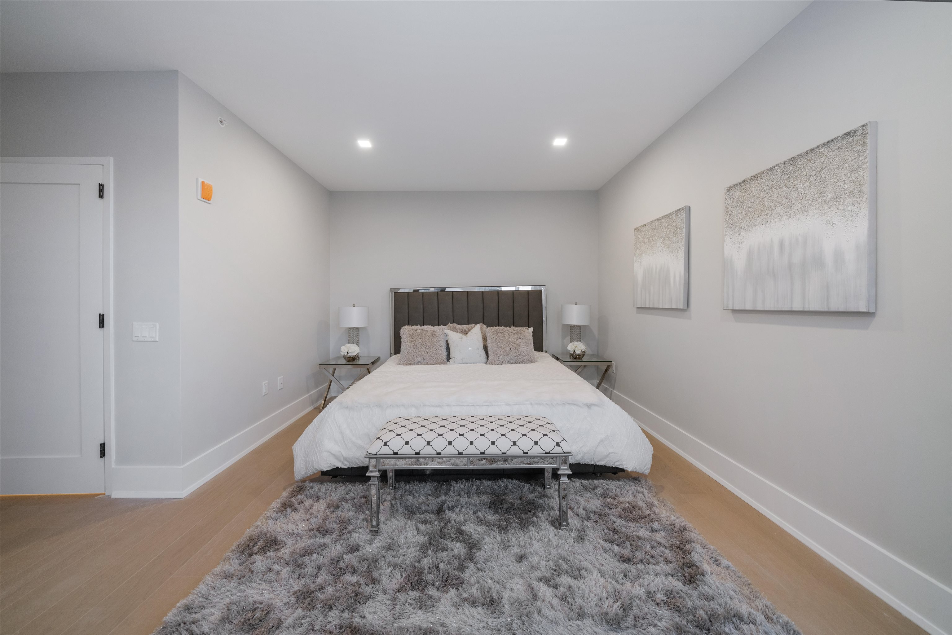 7101 River Road, Unit 310B North Bergen, NJ 07047 - Photo 15 of 36 a bed room with a bed and painting on the wall