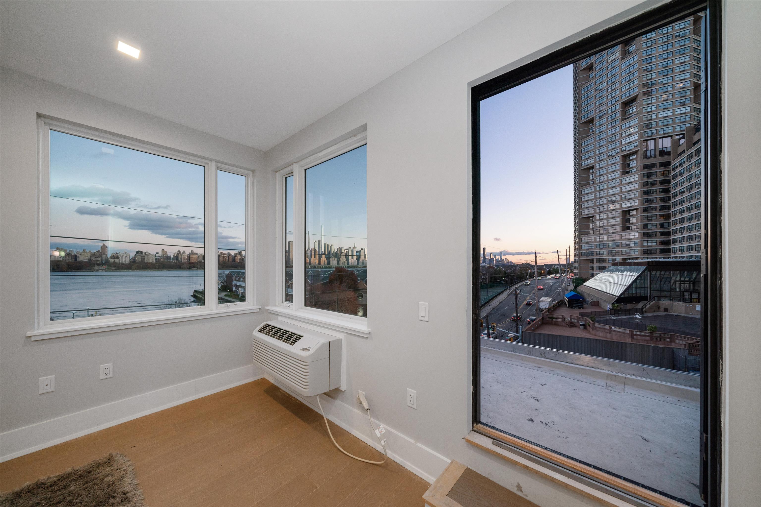 7101 River Road, Unit 310B North Bergen, NJ 07047 - Photo 16 of 36 a view of a living room and entry way