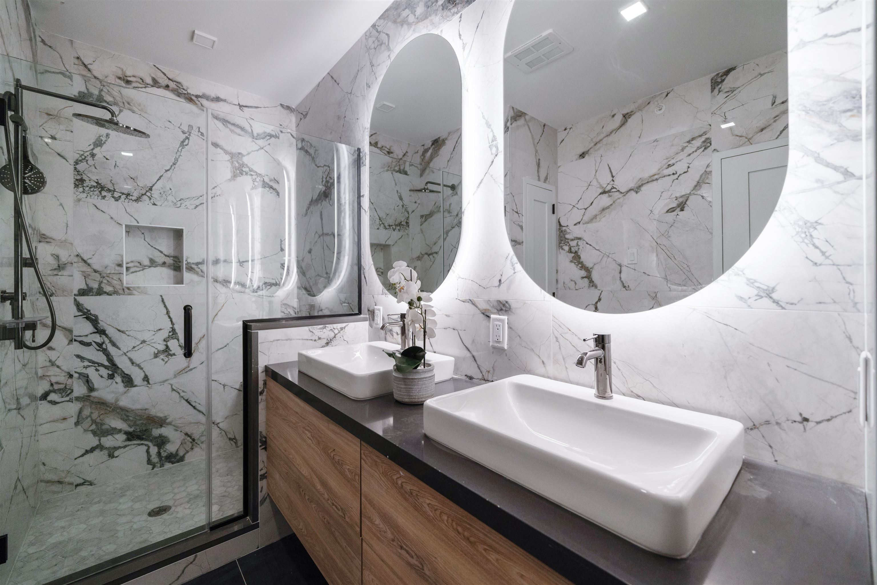 7101 River Road, Unit 310B North Bergen, NJ 07047 - Photo 17 of 36 a bathroom with double vanity sink and a mirror