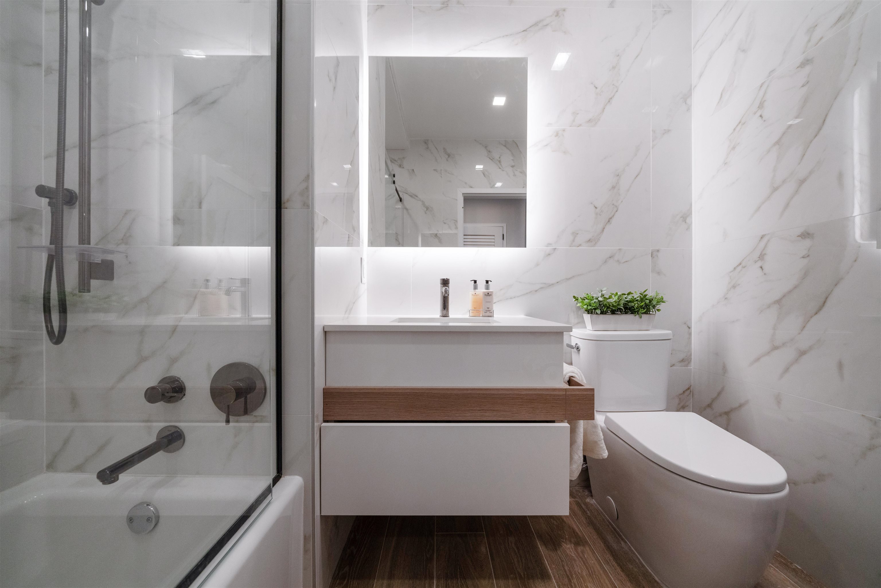 7101 River Road, Unit 310B North Bergen, NJ 07047 - Photo 28 of 36 a bathroom with a sink a toilet and shower