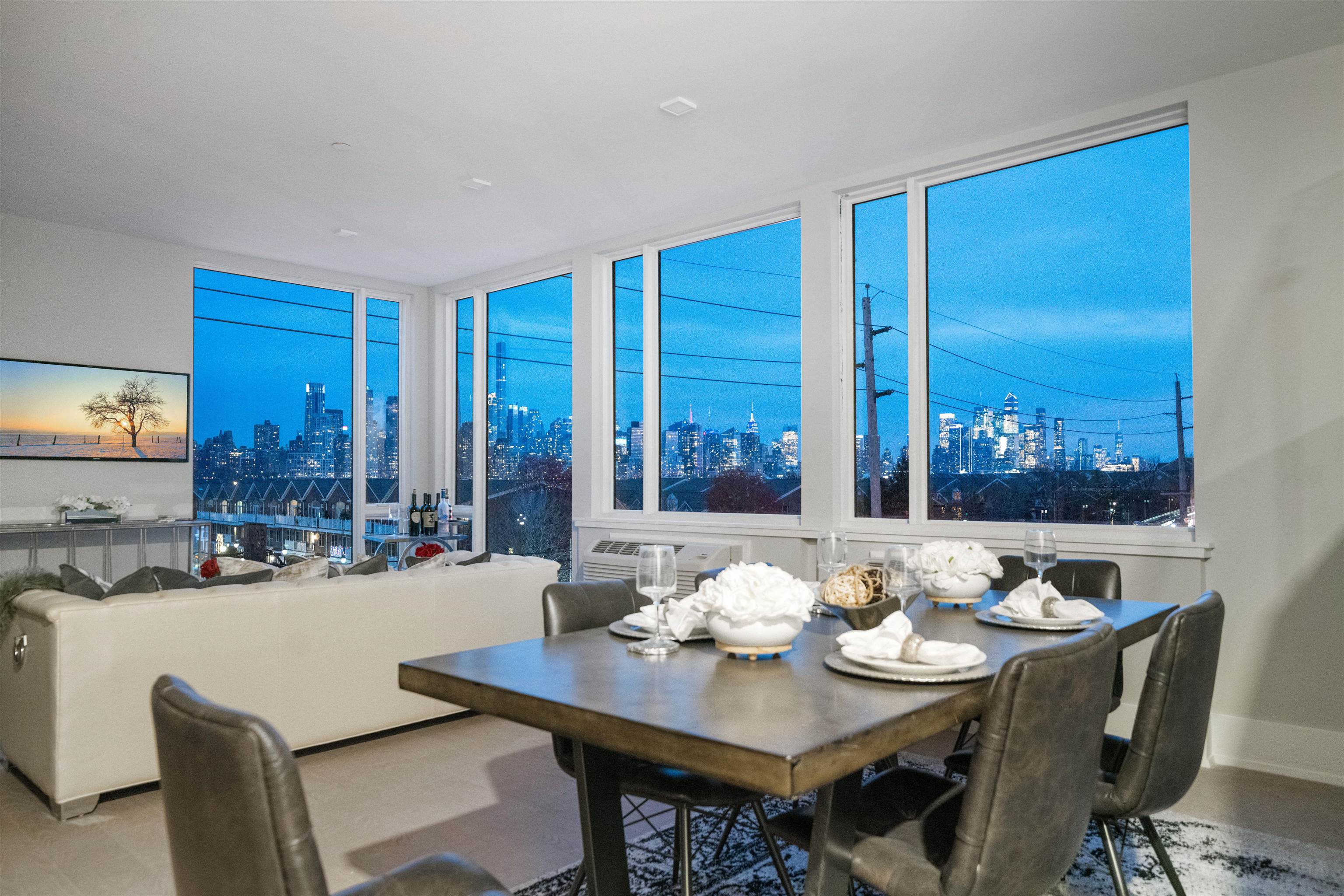 7101 River Road, Unit 310B North Bergen, NJ 07047 - Photo 9 of 36 a view of a dining room with furniture window and outside view