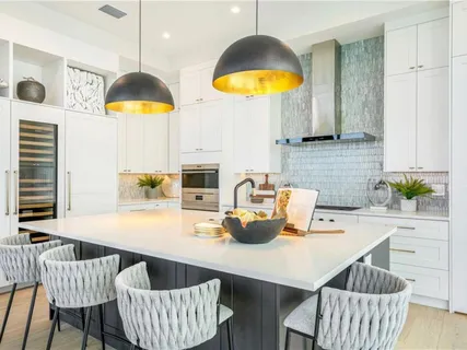 a kitchen with a dining table and chairs