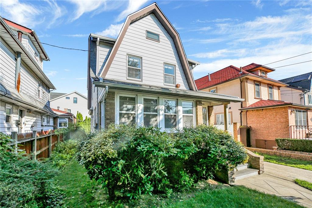 2991 Quentin Road Brooklyn, NY 11229 - Photo 2 of 30 a view of a building next to a yard