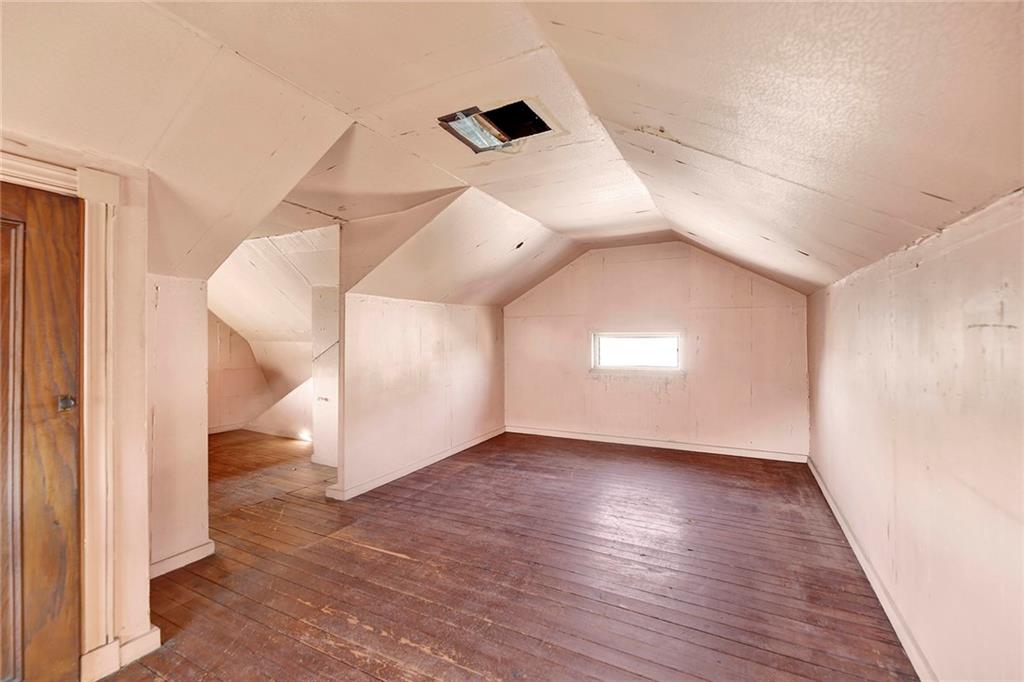 2991 Quentin Road Brooklyn, NY 11229 - Photo 22 of 30 an empty room with wooden floor and entryway