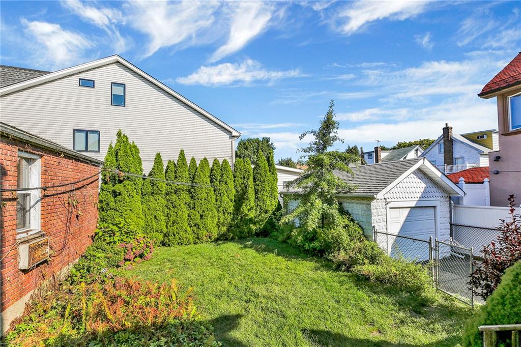 2991 Quentin Road Brooklyn, NY 11229 - Photo 27 of 30 a front view of a house with a yard