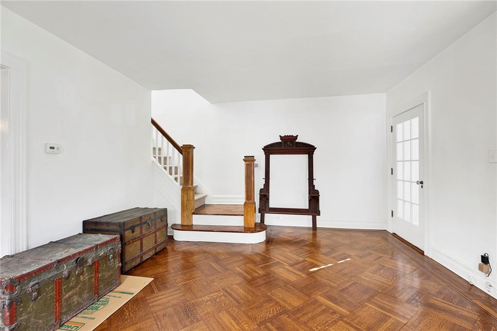 2991 Quentin Road Brooklyn, NY 11229 - Photo 6 of 30 a view of an empty room with stairs