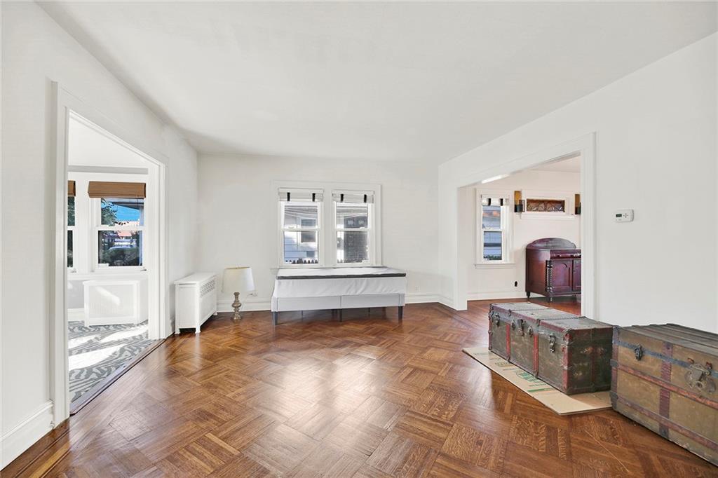 2991 Quentin Road Brooklyn, NY 11229 - Photo 10 of 30 a living room with furniture and a flat screen tv