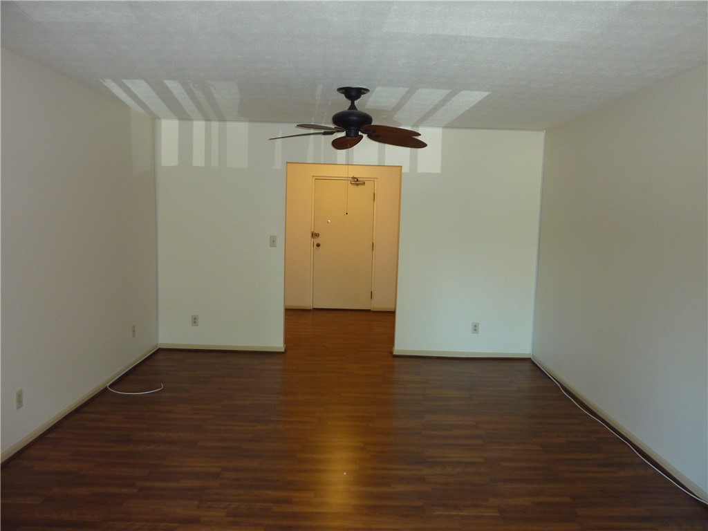 1345 Tattersall Road, Unit 64 Dayton, OH 45459 - Photo 5 of 25 This versatile space features rich wood flooring, offering a blank canvas for personalized design.