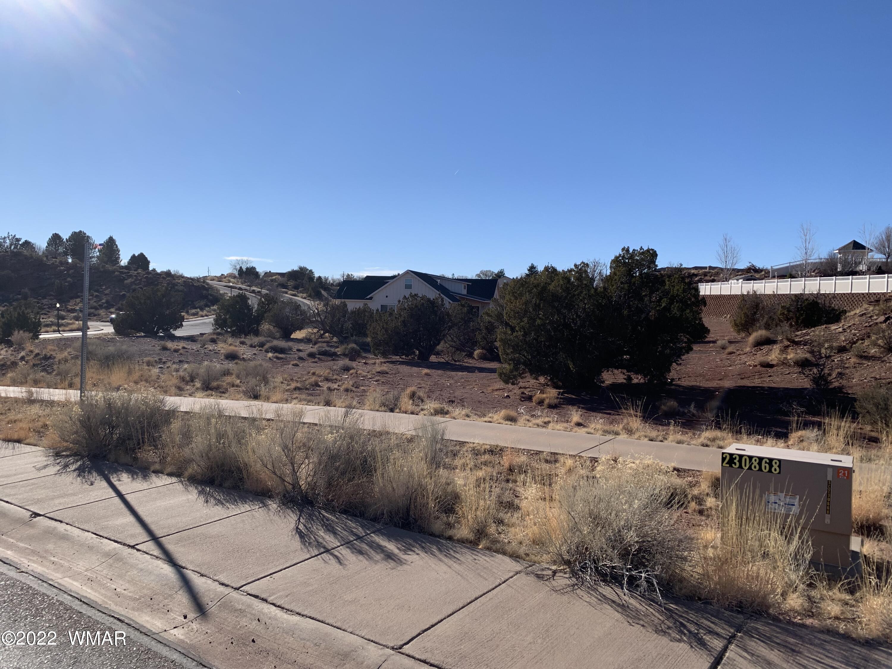 0 South Frontier Parkway Snowflake, AZ 85937 - Photo 1 of 7 a view of a dry yard with wooden fence