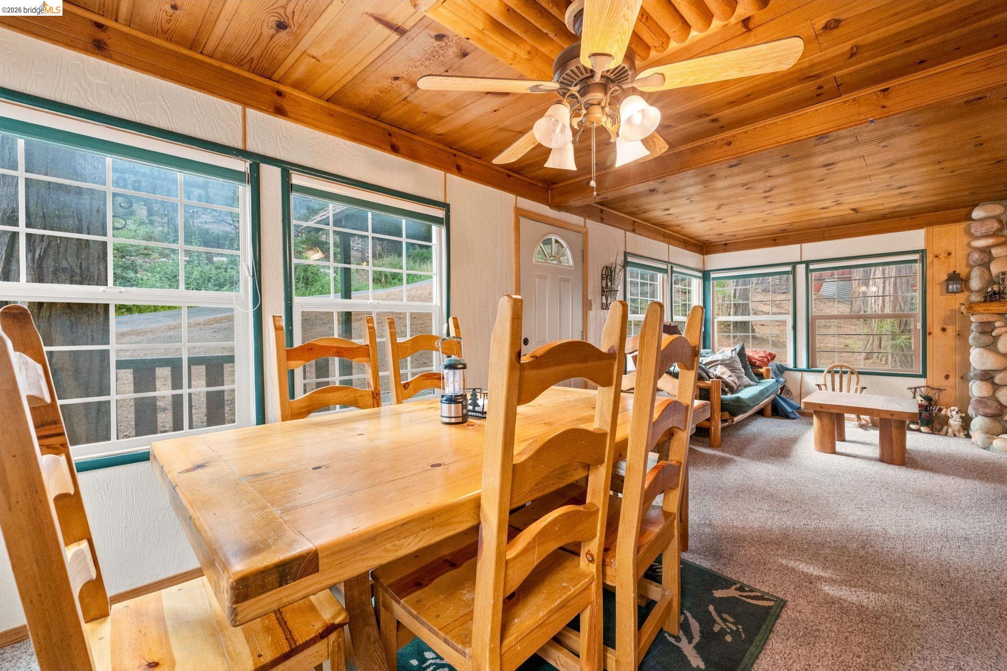 25822 Long Barn Sugar Pine Road Long Barn, CA 95335 - Photo 4 of 28 a view of a dining room with furniture window and outside view