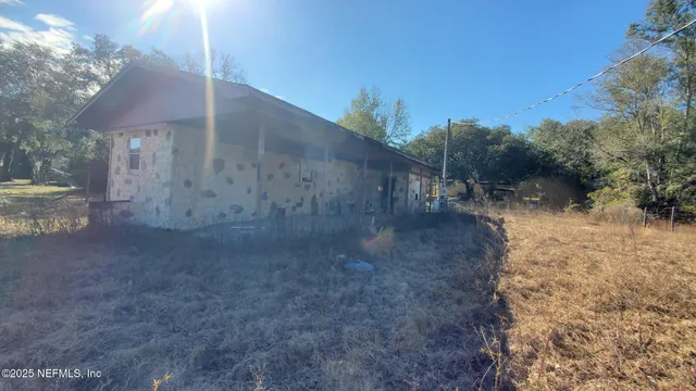a view of a yard with an outdoor space