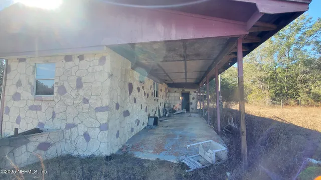 a view of a pathway with a ceiling fan