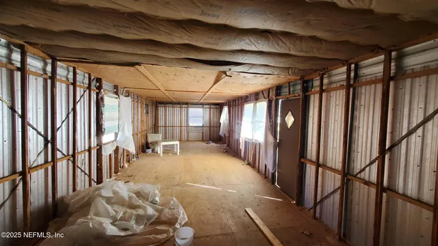 a view of a hallway with stairs