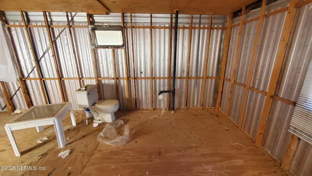 a view of an empty room with stairs