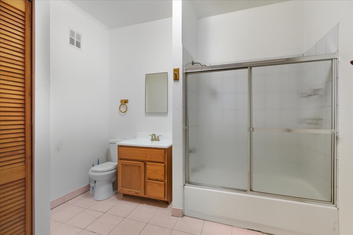 3133 West Augusta Boulevard, Unit 3E Chicago, IL 60622 - Photo 5 of 10 a bathroom with a shower and a toilet