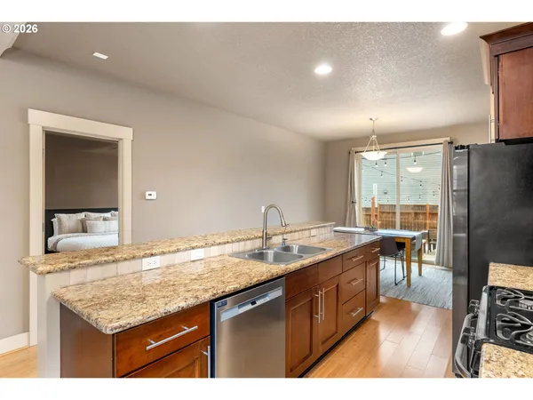 a kitchen with a sink and wooden cabinets