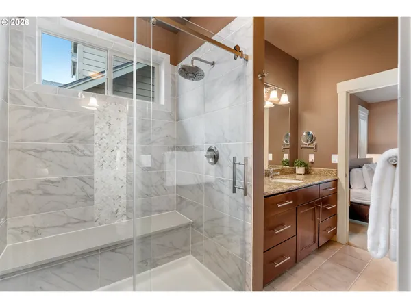 a bathroom with a shower and a sink