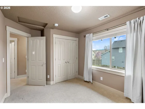 a room with window and a bathroom