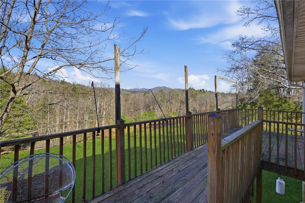 655 Kelley Road Cleveland, GA 30528 - Photo 12 of 41 a view of a balcony with wooden fence