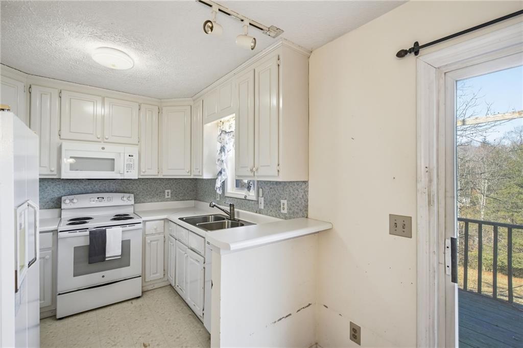 655 Kelley Road Cleveland, GA 30528 - Photo 14 of 41 a room with storage and utility