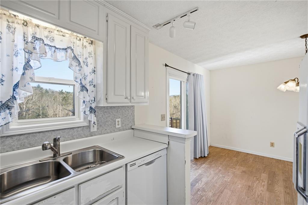 655 Kelley Road Cleveland, GA 30528 - Photo 15 of 41 a kitchen with a sink and refrigerator