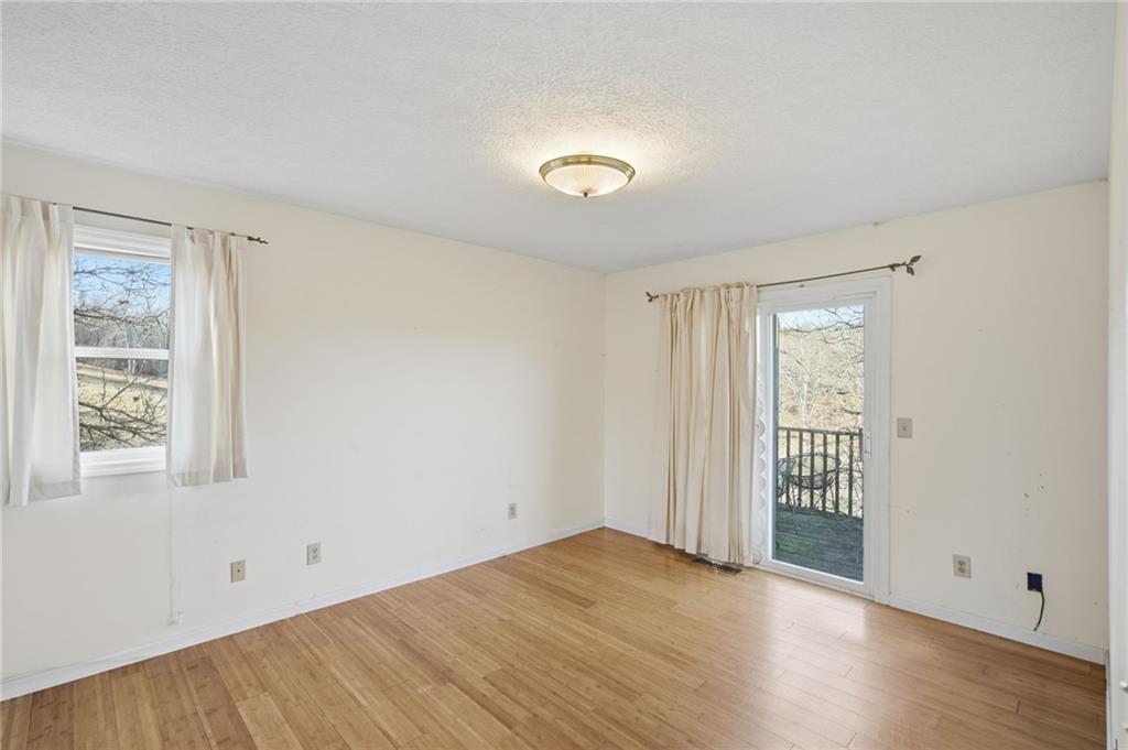 655 Kelley Road Cleveland, GA 30528 - Photo 17 of 41 an empty room with wooden floor and windows