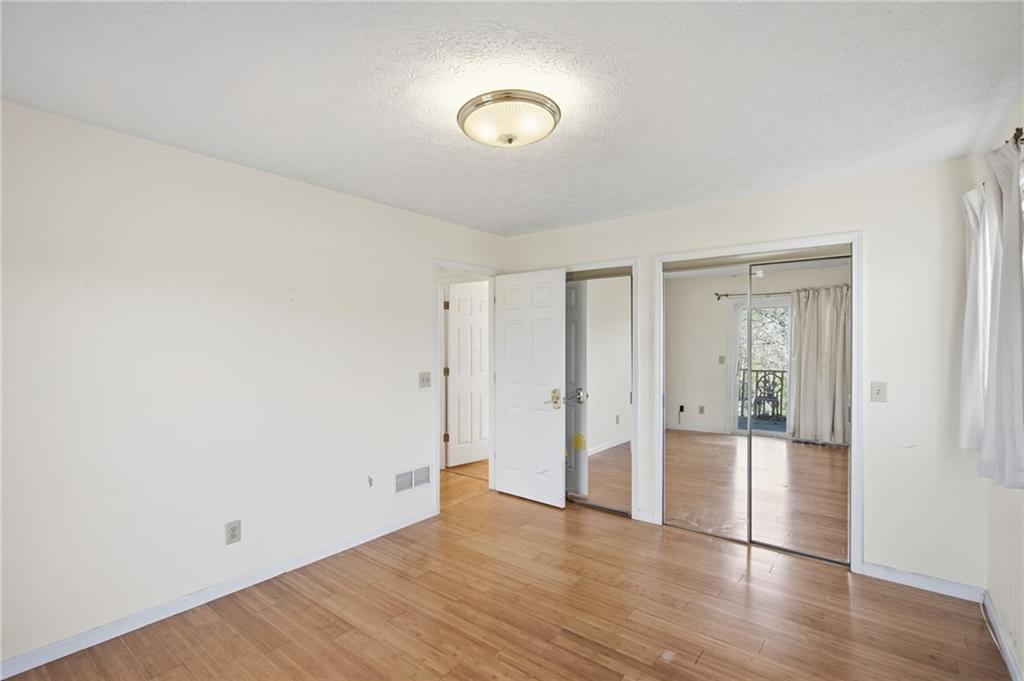 655 Kelley Road Cleveland, GA 30528 - Photo 18 of 41 a view of an empty room with wooden floor and a window