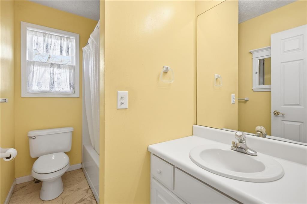 655 Kelley Road Cleveland, GA 30528 - Photo 23 of 41 a bathroom with a toilet sink and mirror