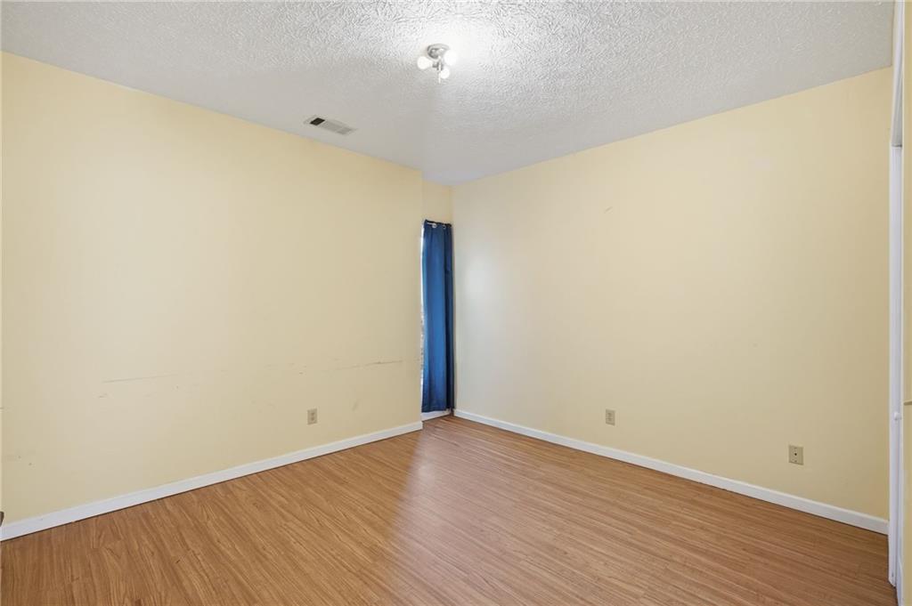 655 Kelley Road Cleveland, GA 30528 - Photo 24 of 41 a view of empty room with wooden floor