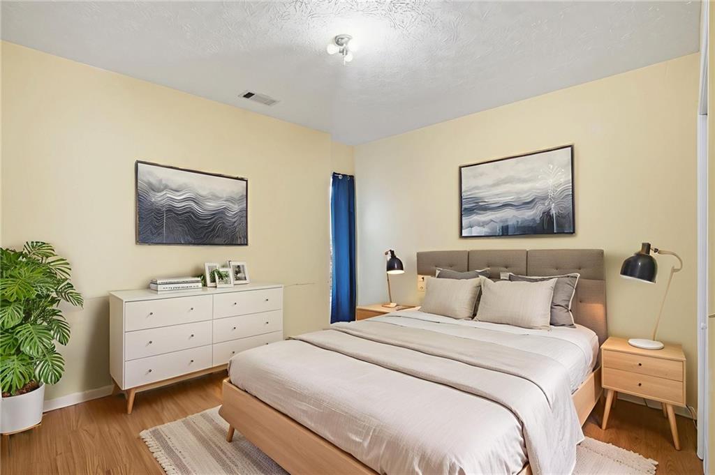 655 Kelley Road Cleveland, GA 30528 - Photo 25 of 41 a bedroom with a bed and a table