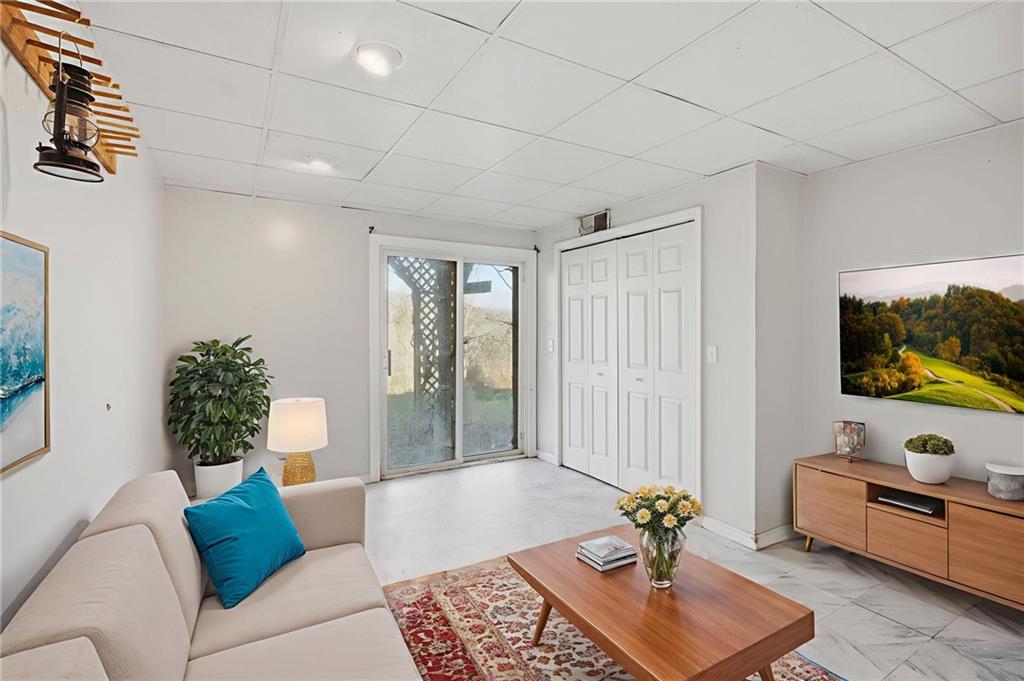 655 Kelley Road Cleveland, GA 30528 - Photo 27 of 41 a living room with furniture and a flat screen tv