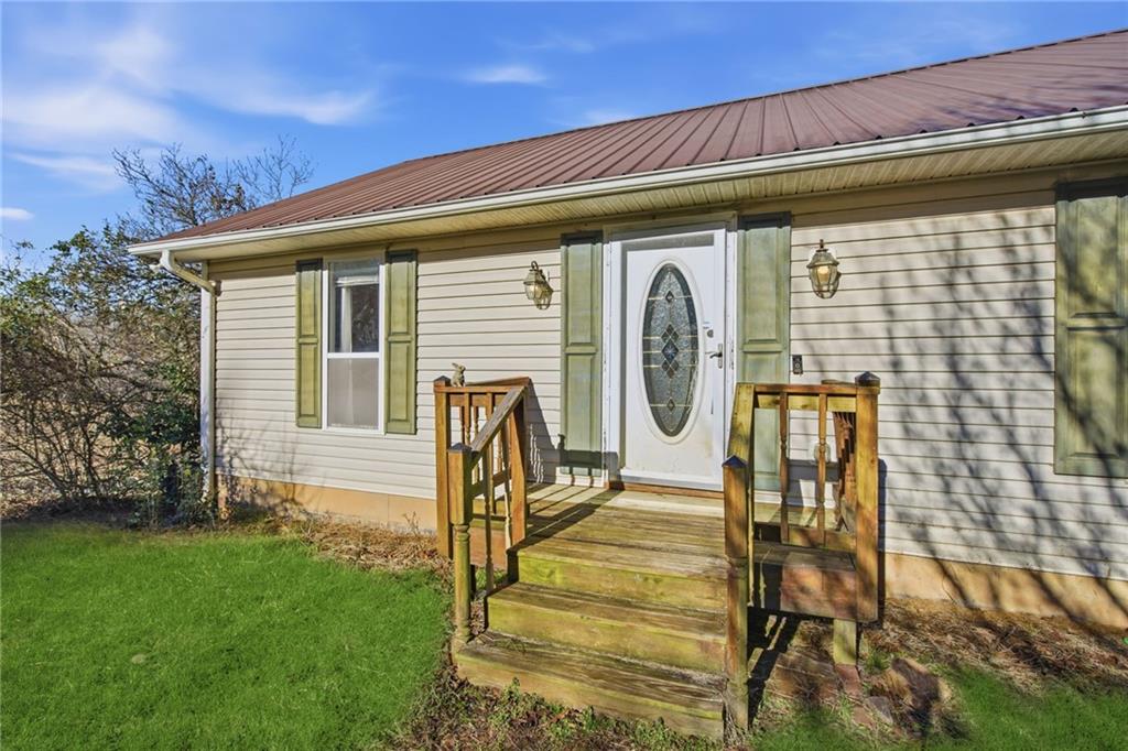 655 Kelley Road Cleveland, GA 30528 - Photo 5 of 41 a front view of a house with garden
