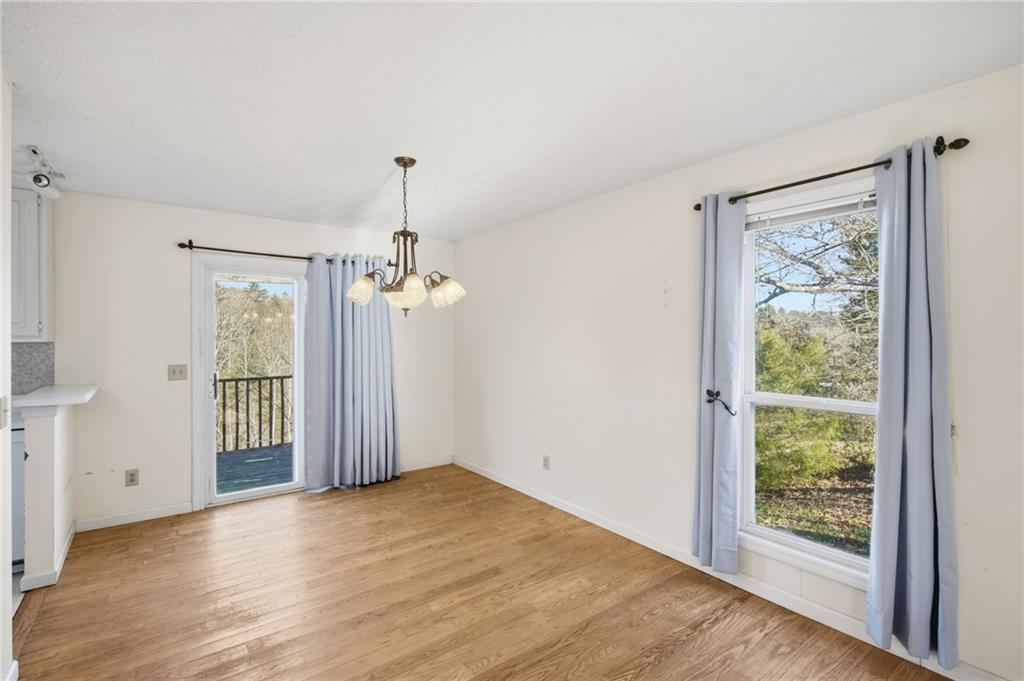 655 Kelley Road Cleveland, GA 30528 - Photo 9 of 41 wooden floor in an empty room with a window