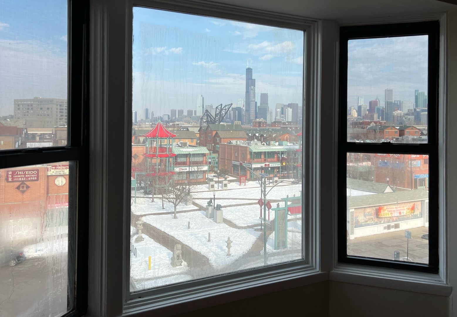 2131 South Archer Avenue, Unit 306 Chicago, IL 60616 - Photo 5 of 15 a view of a glass building from a window