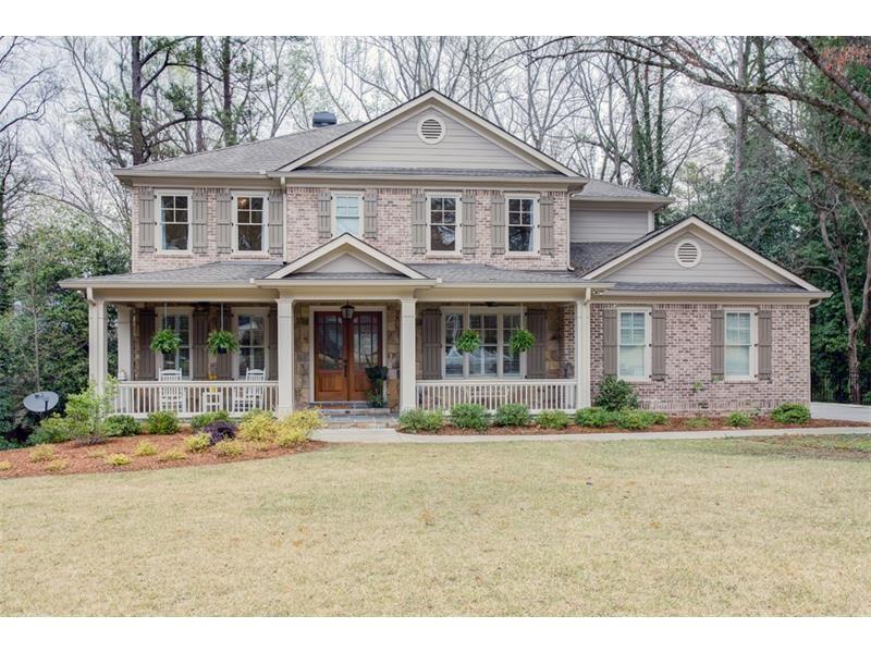 1120 Pine Ridge Road Northeast Atlanta, GA 30324 - Photo 1 of 1 a front view of a house with a yard