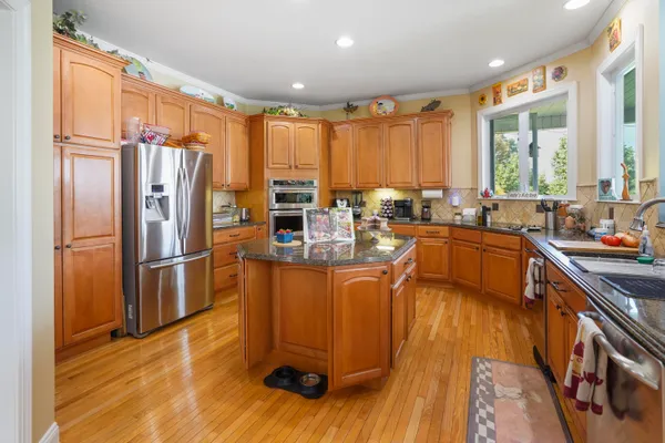 a kitchen with sink cabinets and window