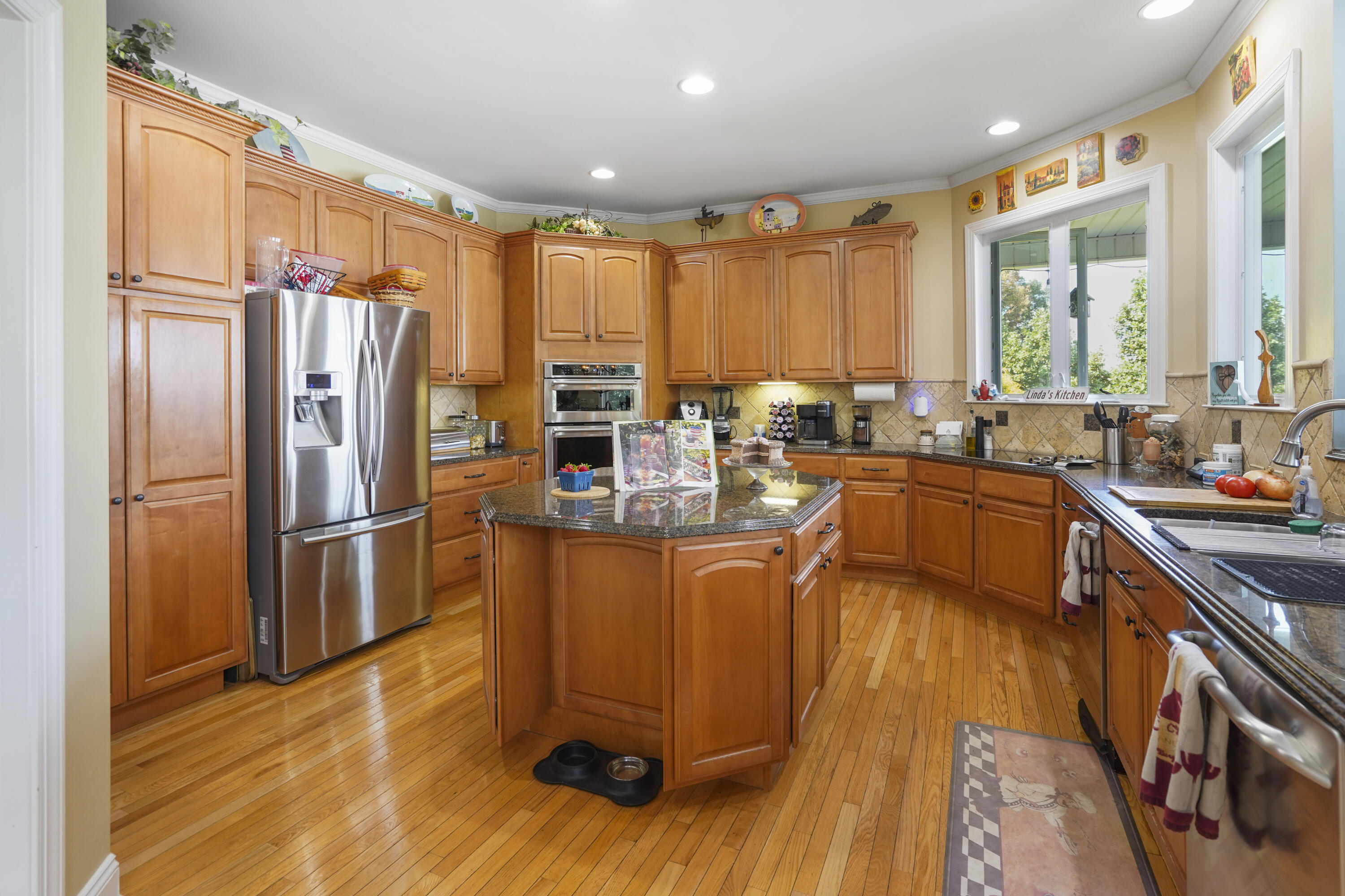 544 Wood Brook Road Moneta, VA 24121 - Photo 11 of 66 a kitchen with stainless steel appliances a refrigerator sink and cabinets