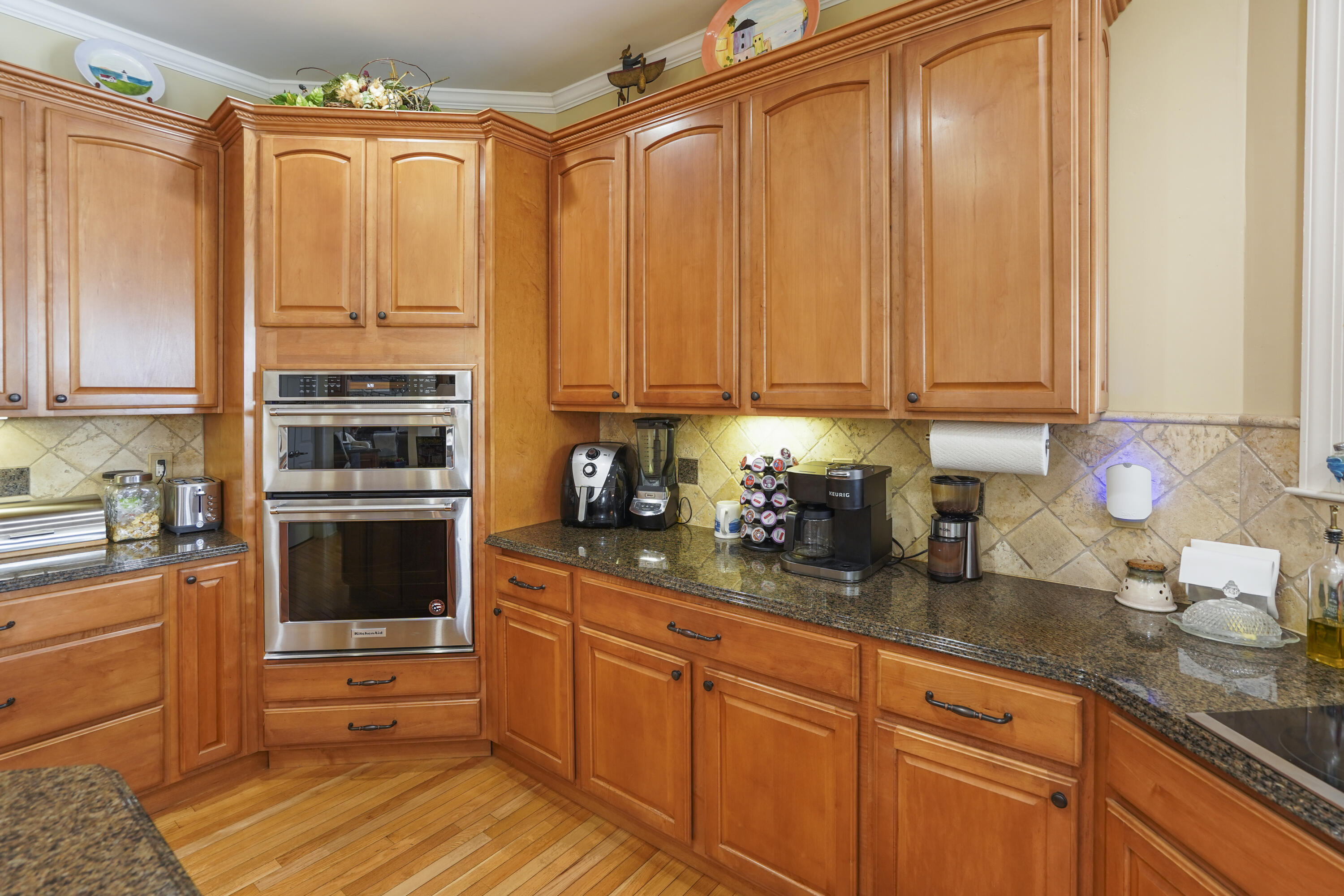 544 Wood Brook Road Moneta, VA 24121 - Photo 13 of 66 a kitchen with stainless steel appliances granite countertop a stove a sink and a refrigerator with wooden cabinets